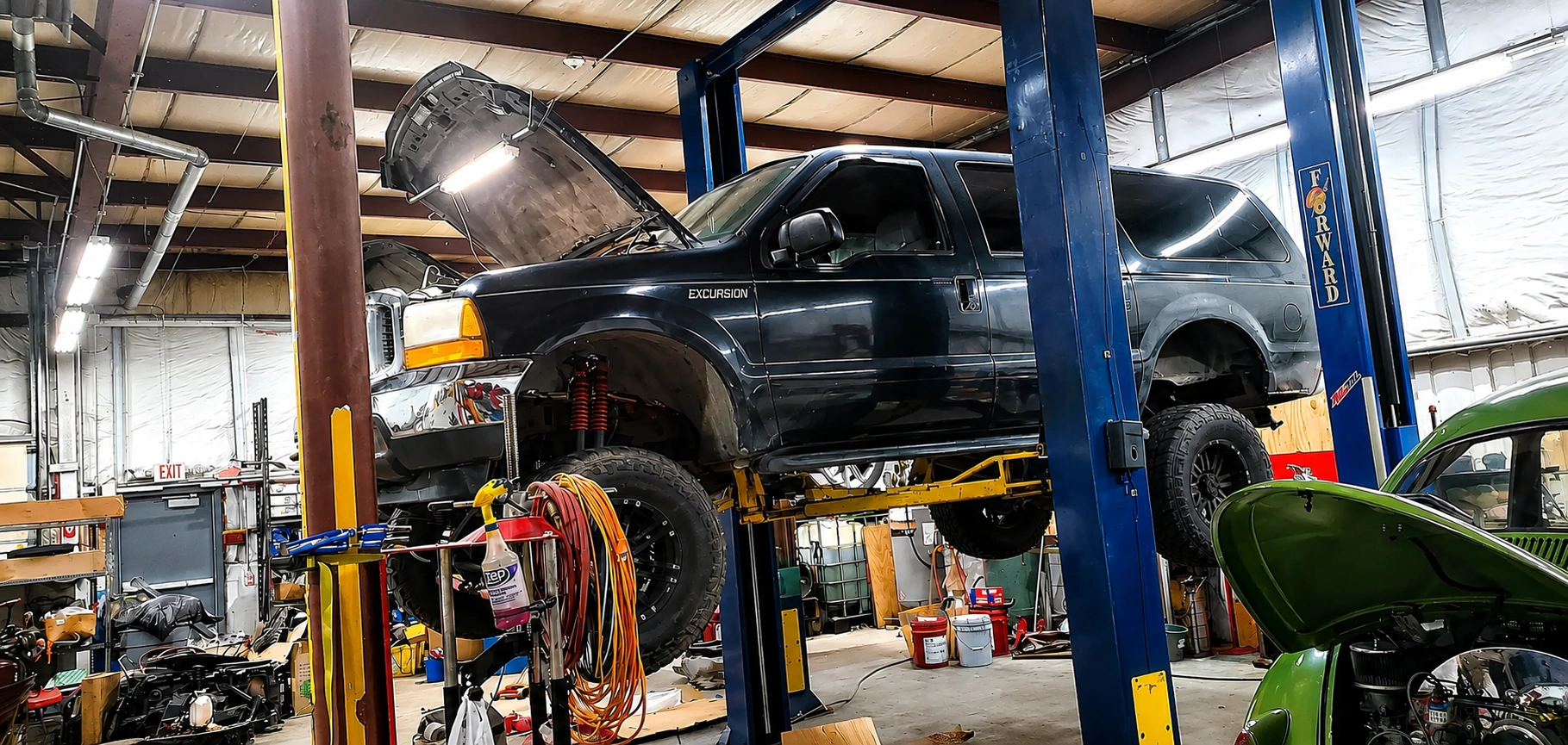 Ford Excursion on lift side view